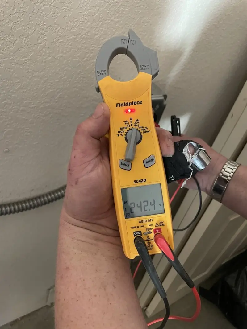 Voltage testing with clamp meter during Ceiling Fan Installation in Fawn